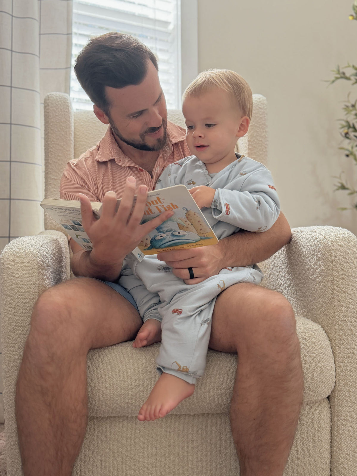 Light gray footed sleep sack with allover vehicle print and full-length zipper