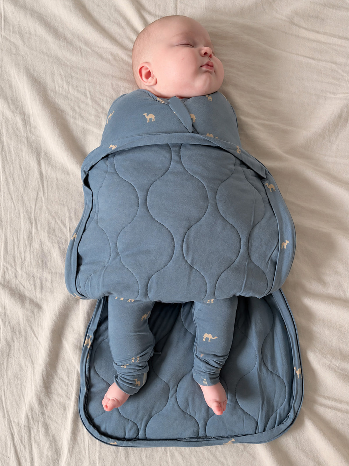 Blue 2.5 TOG swaddle sleep sack with camel print, quilted back panel