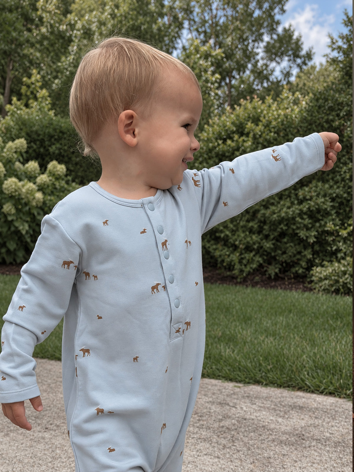 Light blue baby henley jumpsuit with long sleeves, moose print, front button placket