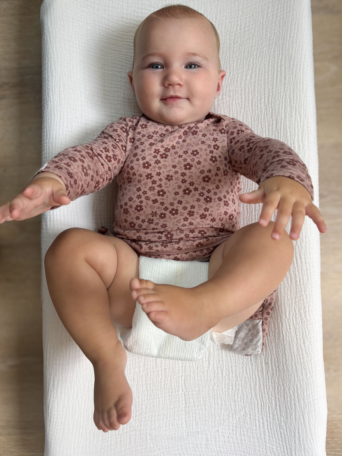 Floral convertible pajama romper, long sleeves and open legs with zipper closure