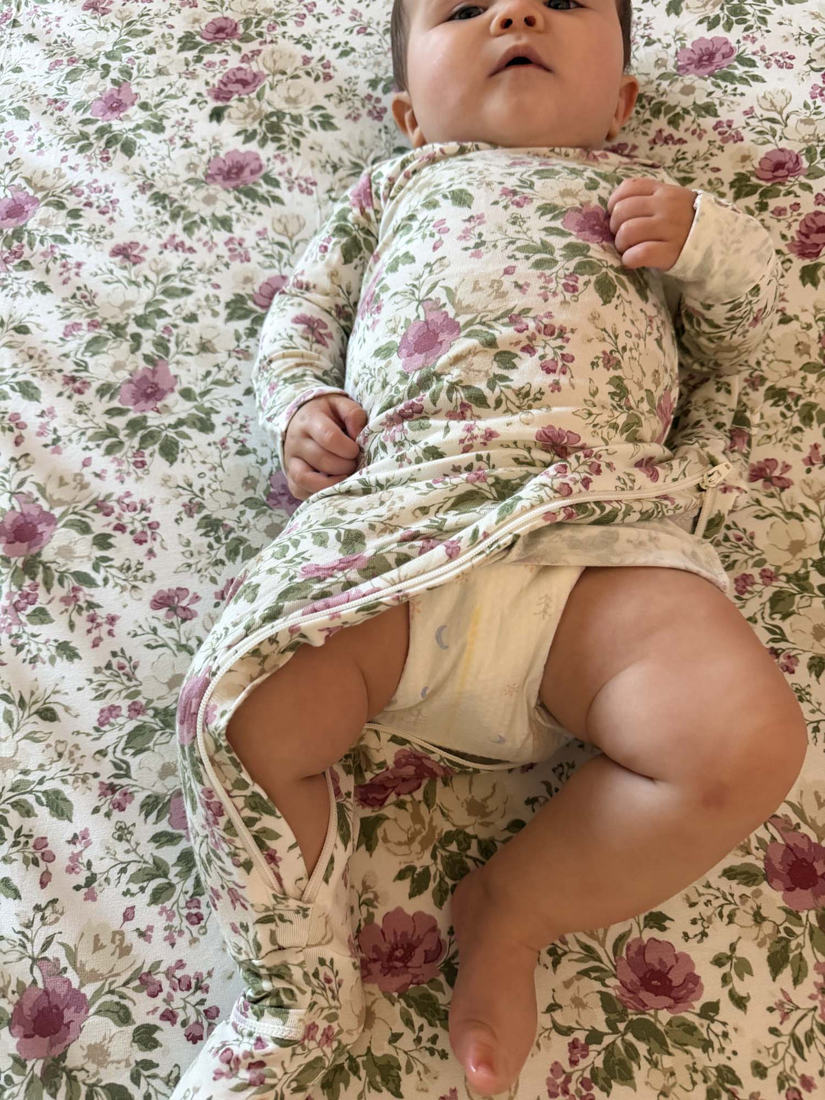 Floral convertible pajama for baby with long sleeves and footed legs, one-piece fit