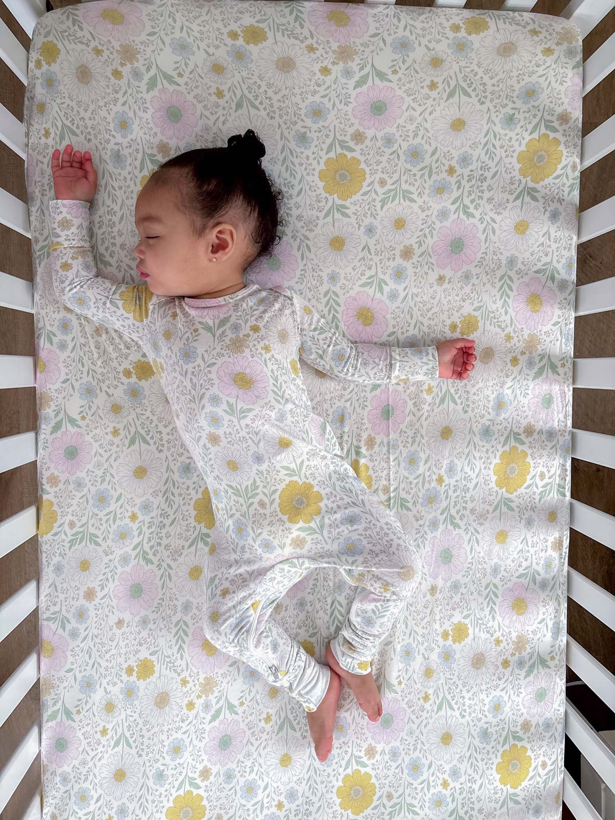 Floral convertible pajama with long sleeves and footed legs, pastel wildflower pattern
