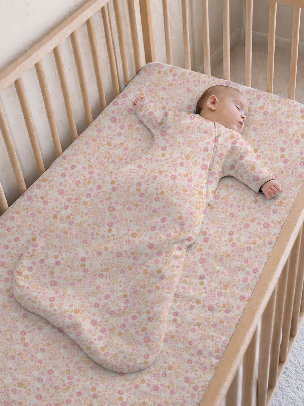 Long-sleeve swaddle sack in light pink floral, long sleeves and enclosed pouch