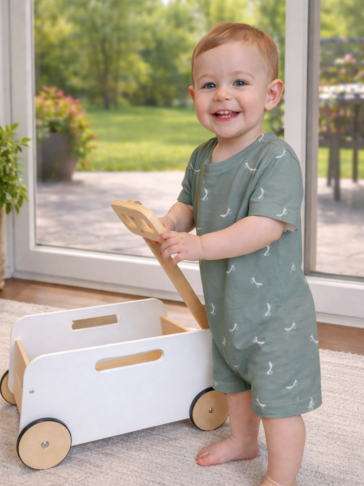 Sage green cotton short romper with white animal prints, crew neck and short legs