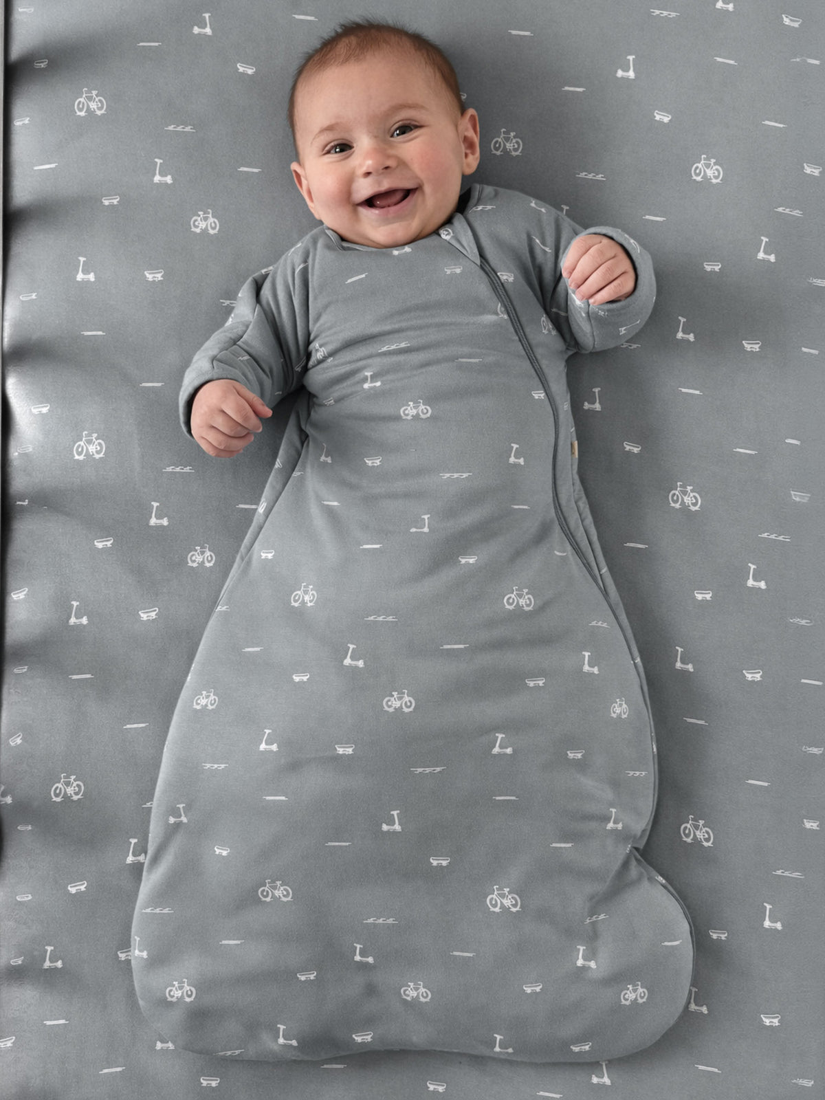 Long-sleeve swaddle sack, dark gray with repeating letters and bike icons