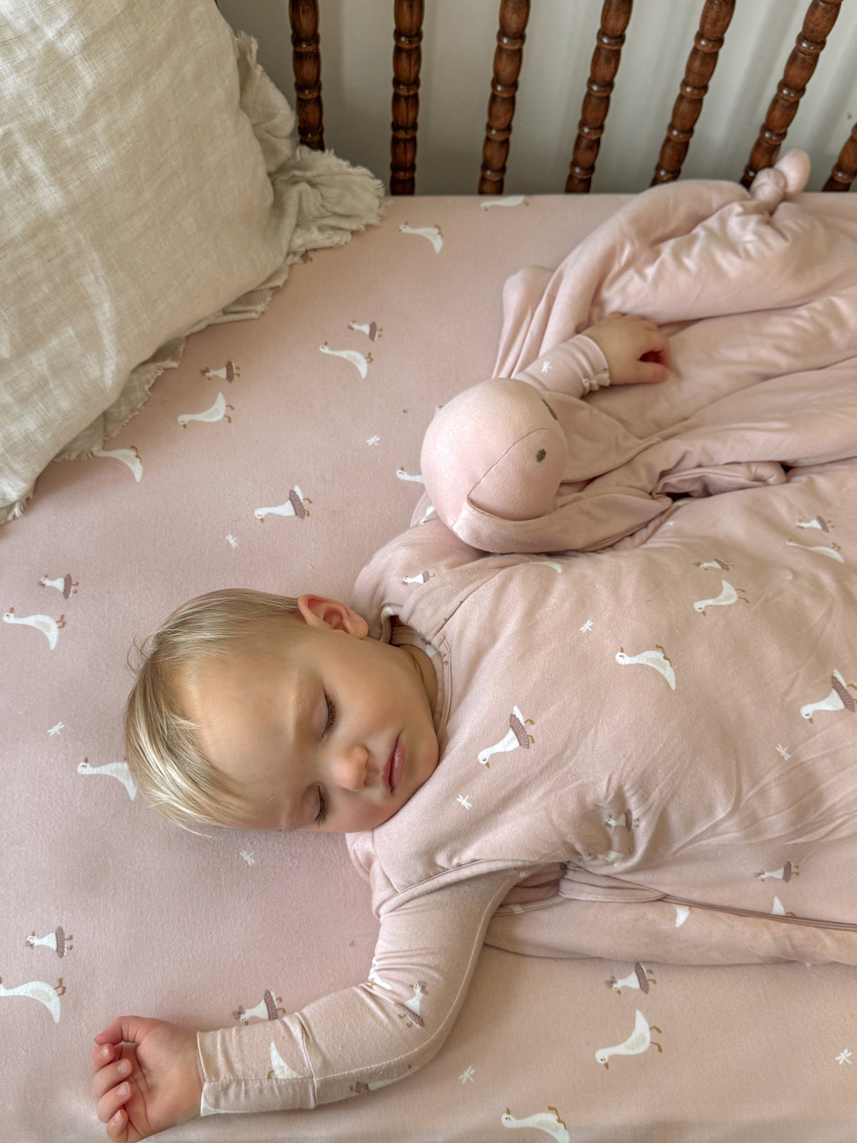 Pale pink bunny lovey with white bird pattern and attached plush bunny head