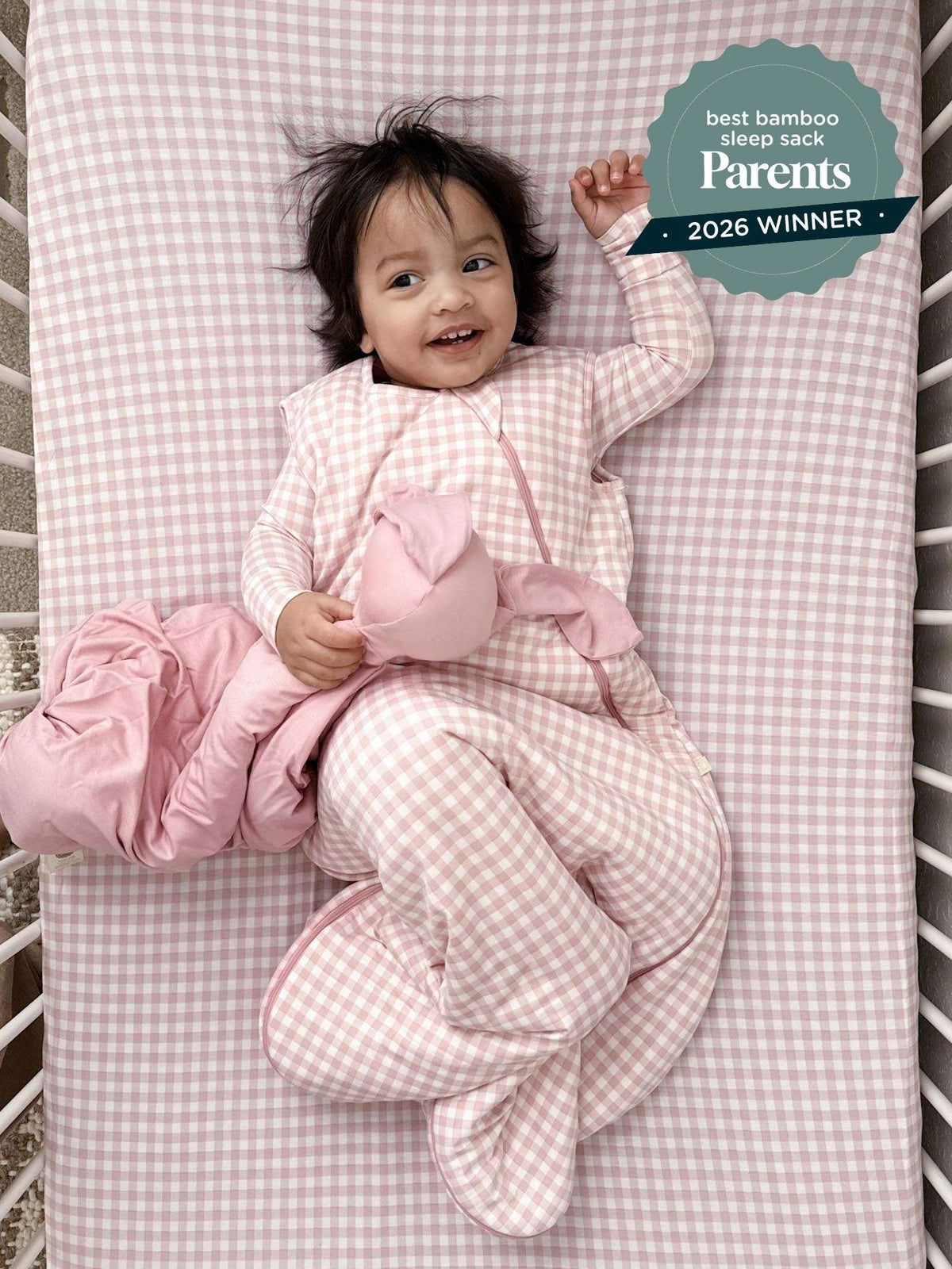 Pink gingham sleep sack with front zipper and soft quilted fabric