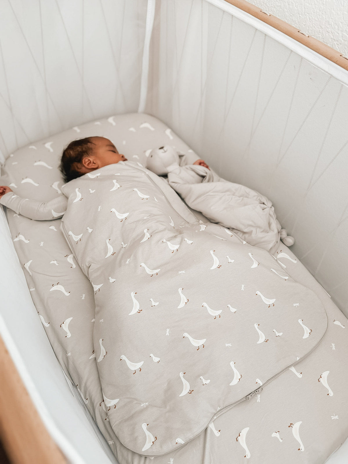 0.5 TOG goose print sleep sack, light gray with scattered white geese, long-sleeve bag