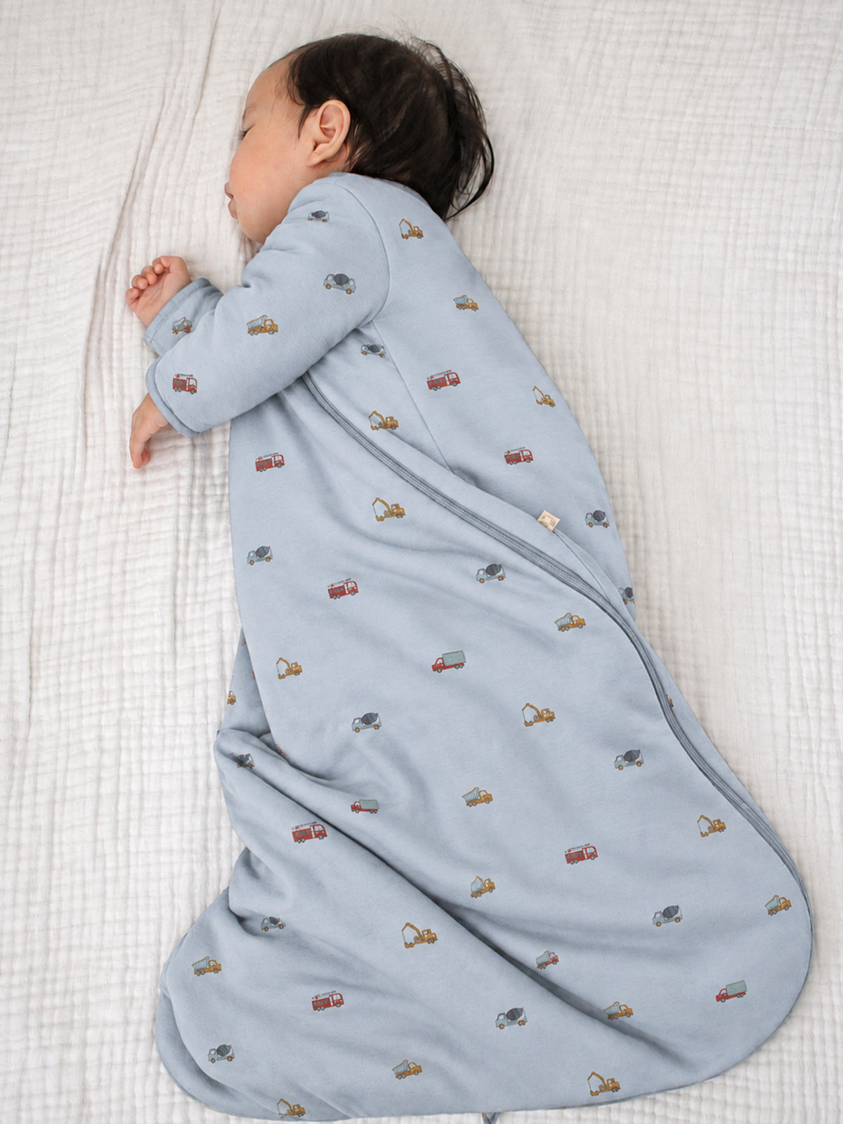 Light blue long-sleeve sleep sack with allover vehicle pattern and zipper front opening