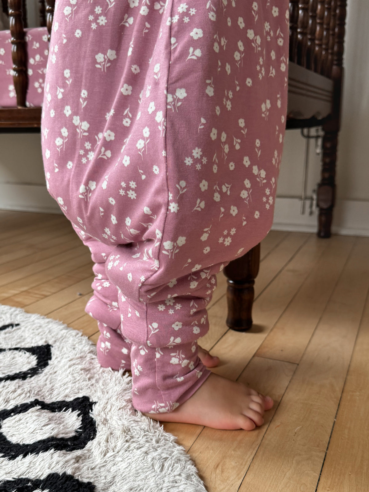 Mauve floral footie sleep sack with elastic cuffs and open feet