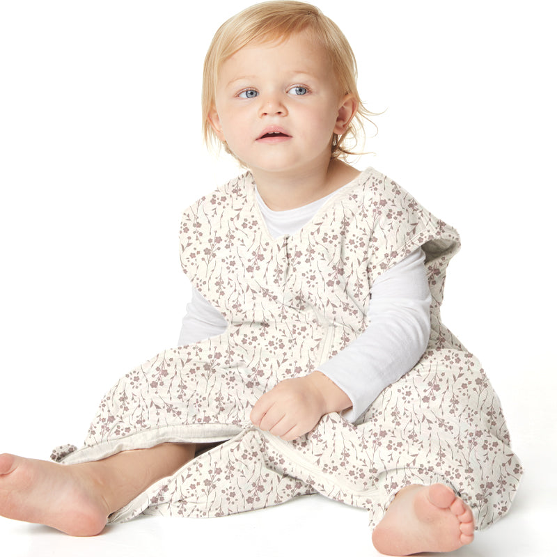 Footed sleep sack for baby in cream with brown floral sprigs, long sleeves