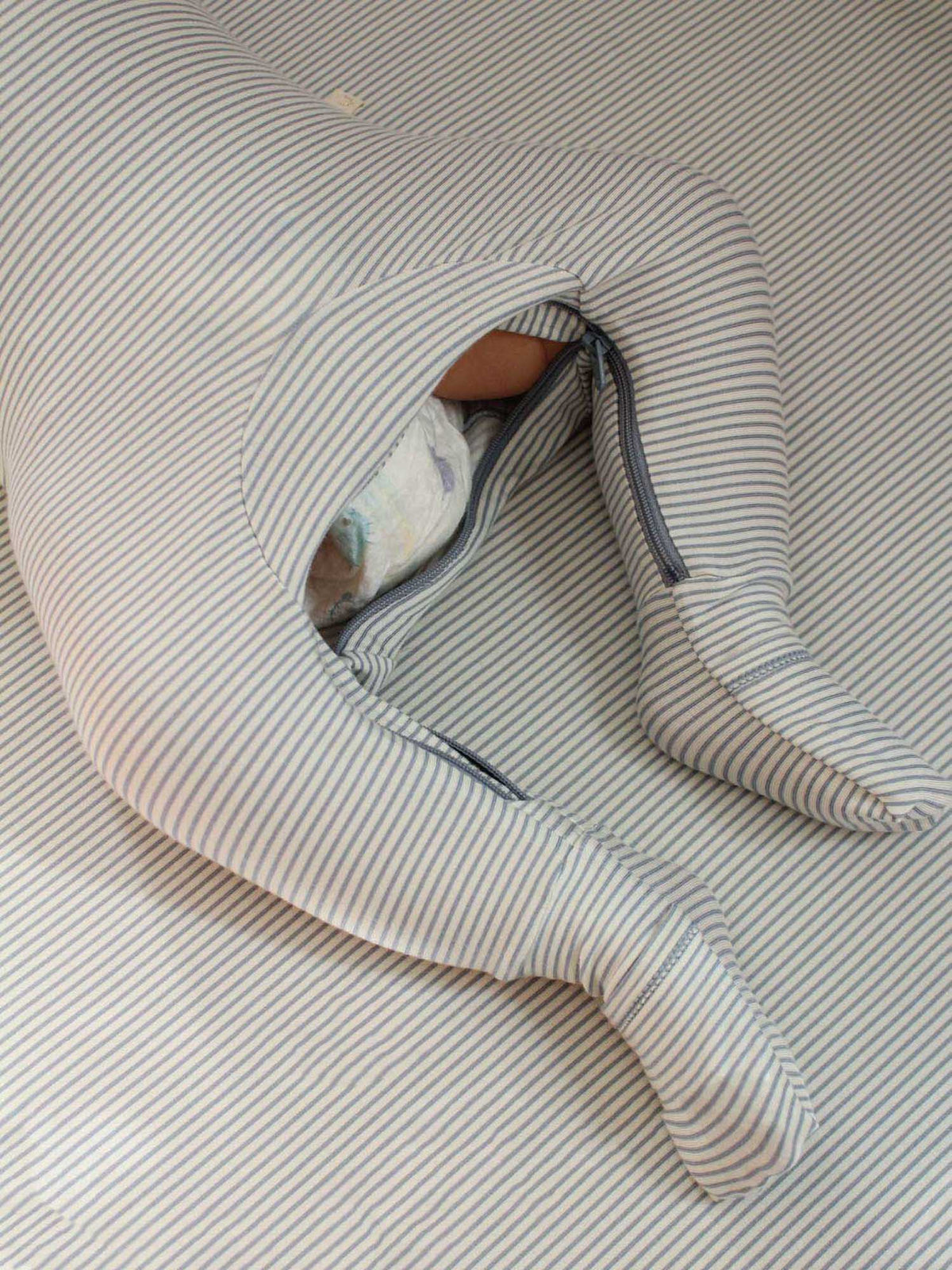 Blue-and-white striped pajama leg opening with dark trim and lined interior