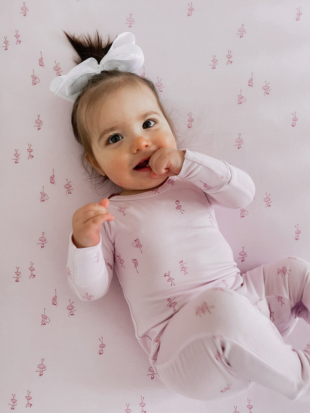 Light pink baby convertible pajama with ballet dancer print, long sleeves and footed legs