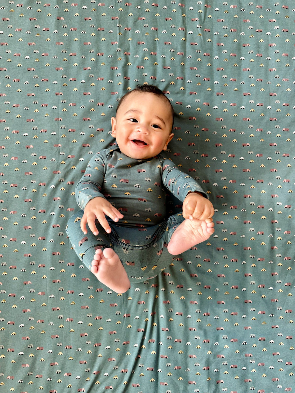 Dark gray printed baby pajamas with long sleeves and footed legs
