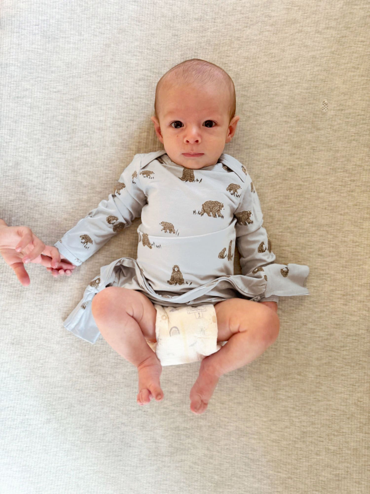Teddy-printed long-sleeve convertible pajama on baby, one-piece with foot covers