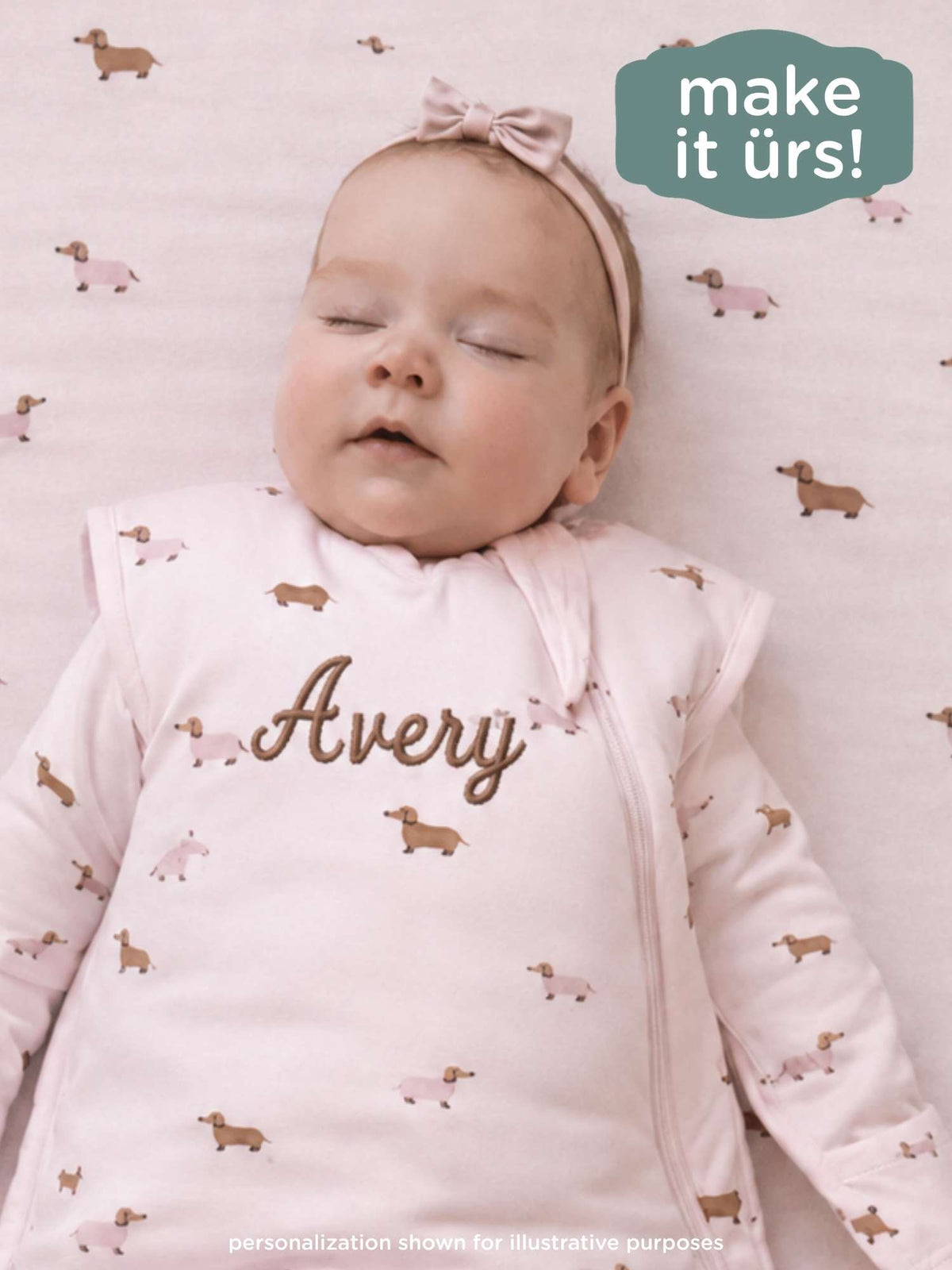 Light pink dog-print swaddle sleep sack with embroidered name "Avery"