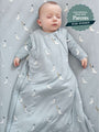 Light blue sleep sack with white goose print, worn by baby