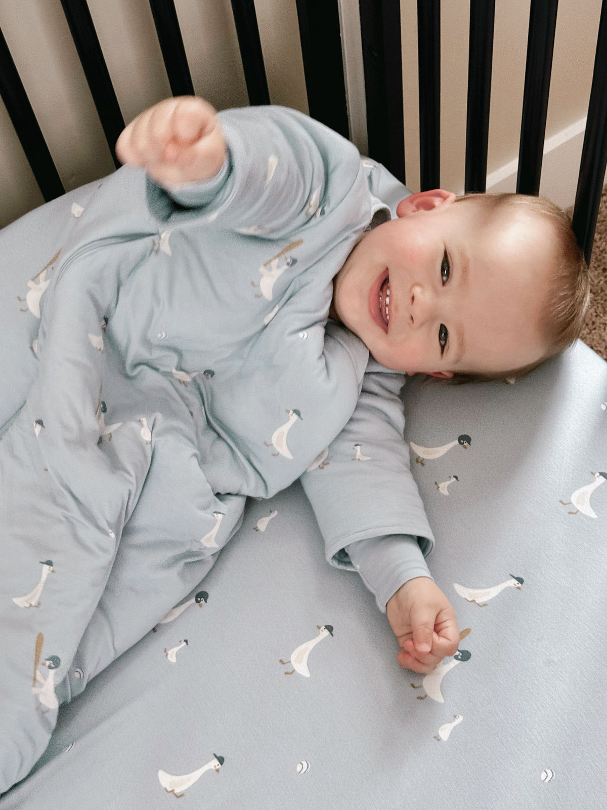 Light blue long-sleeve sleep sack with all-over goose print, wearable baby TOG 1.0