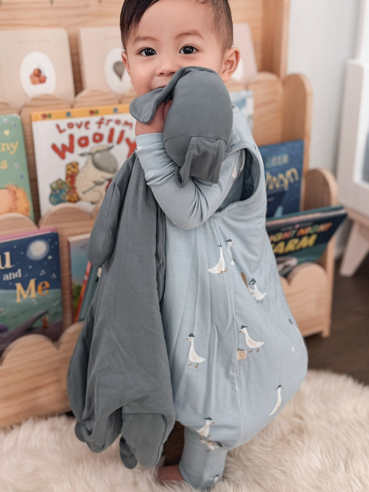 Footie sleep sack light blue with swan print, zip front, and fold-over mitts