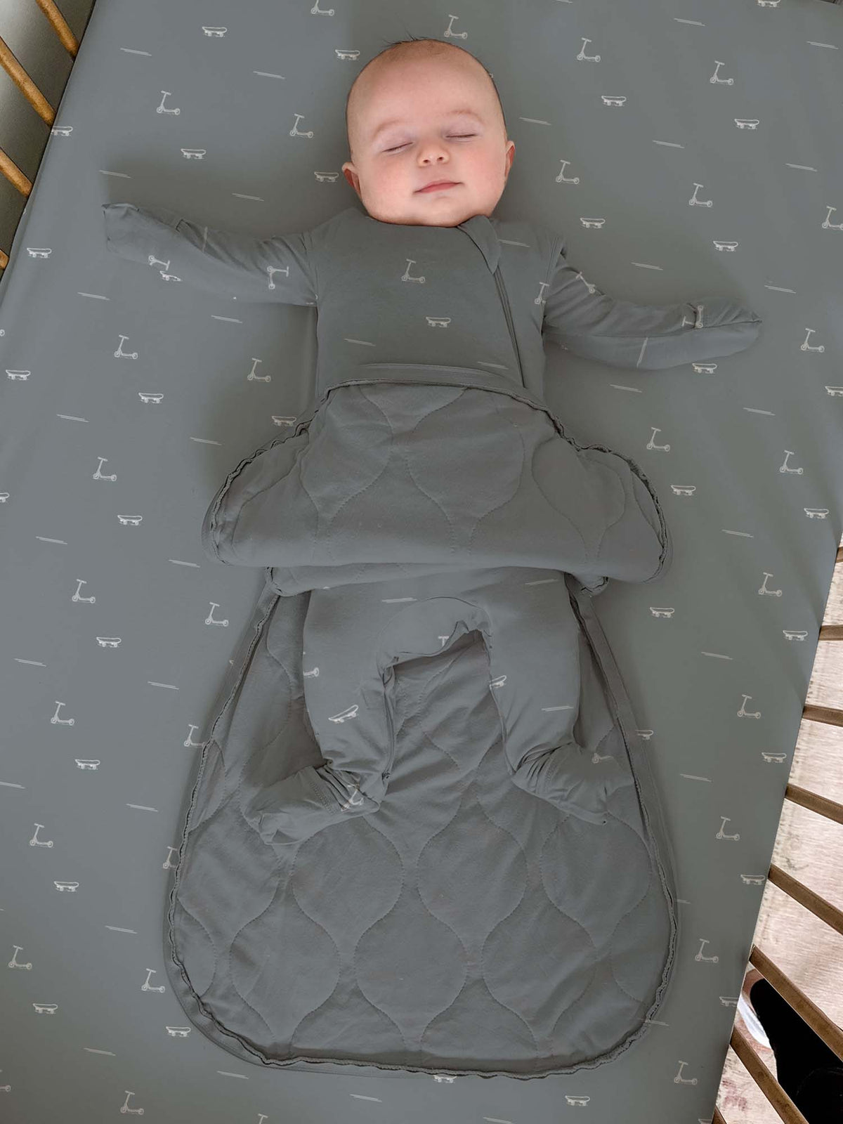 1.0 TOG transitional swaddle sleep sack, gray with dash pattern, front view with leg pocket