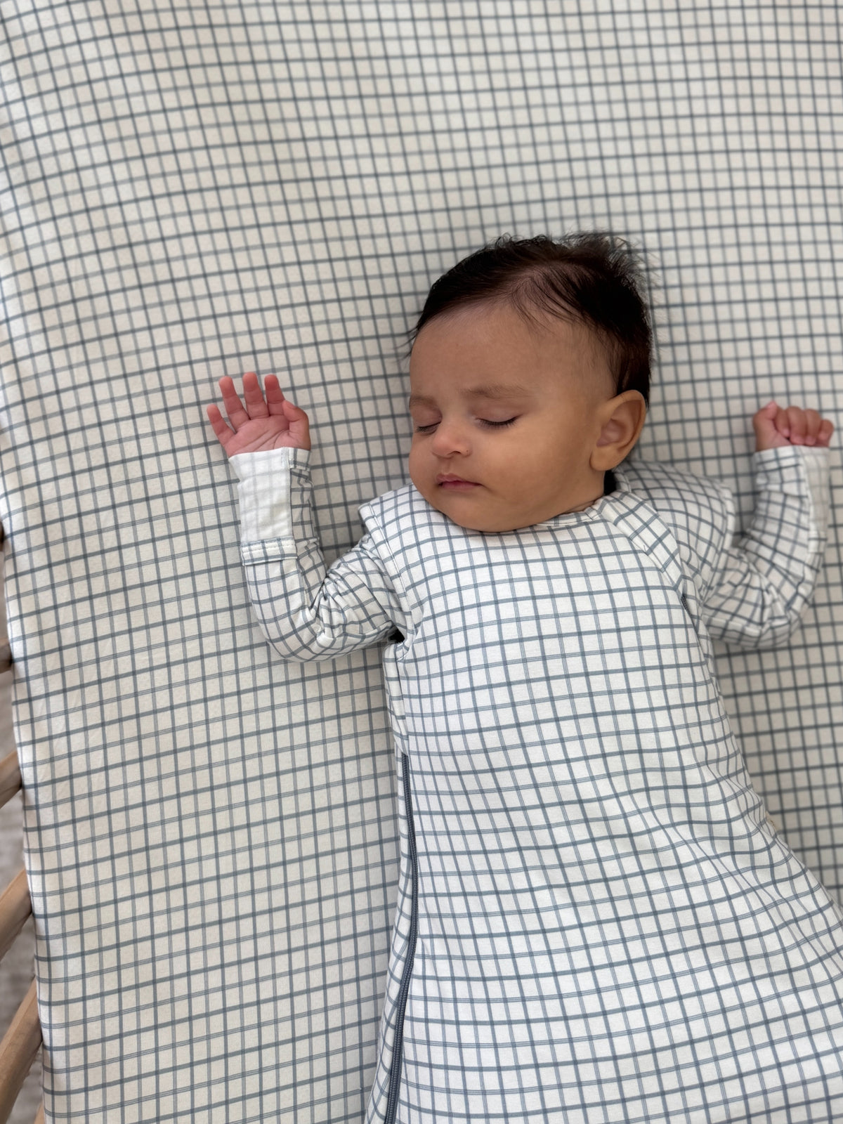 Checkered transitional swaddle sleep sack with long sleeves and side zipper