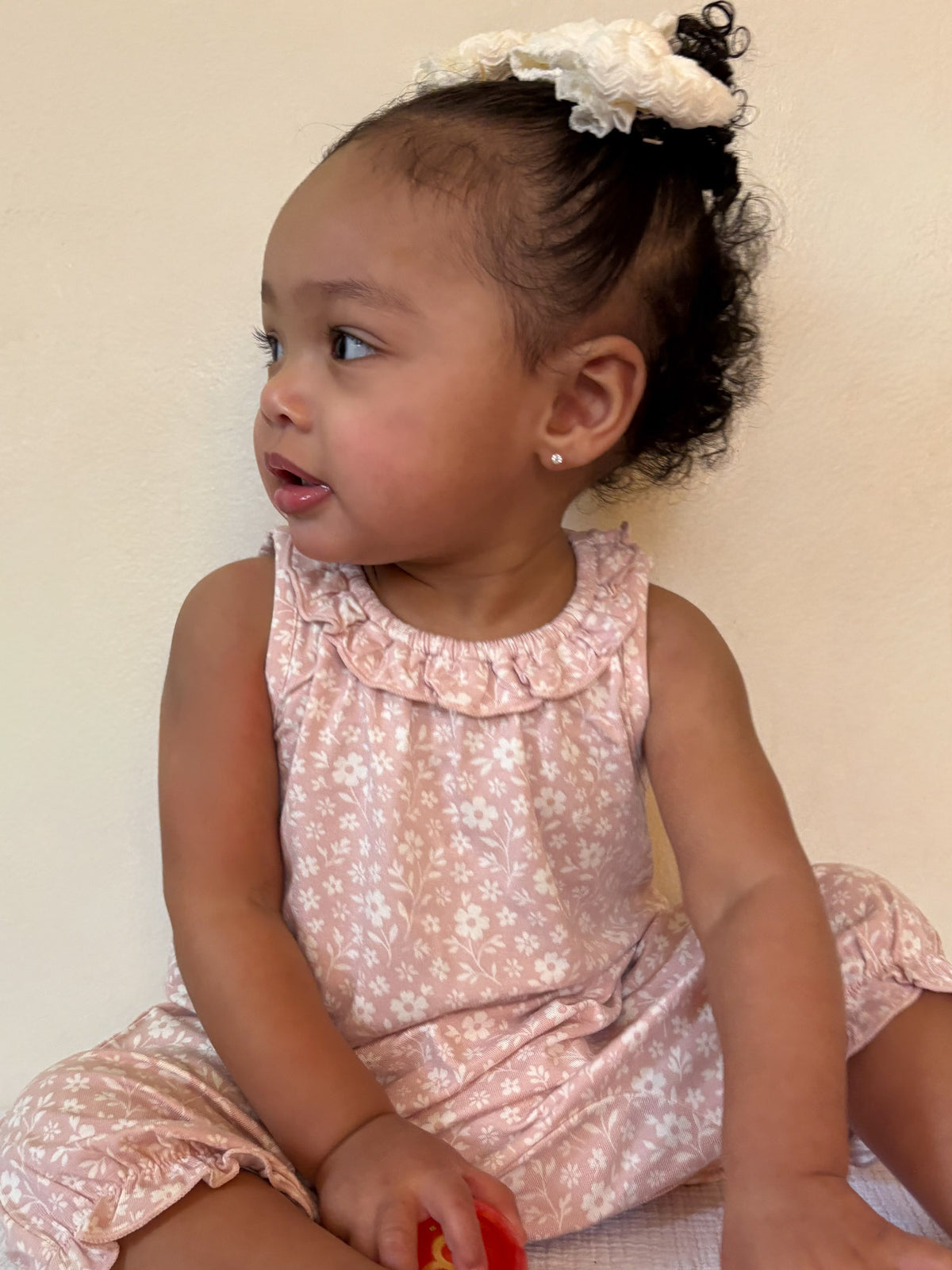 Light pink floral bubble romper, sleeveless with ruffled collar and bubble legs