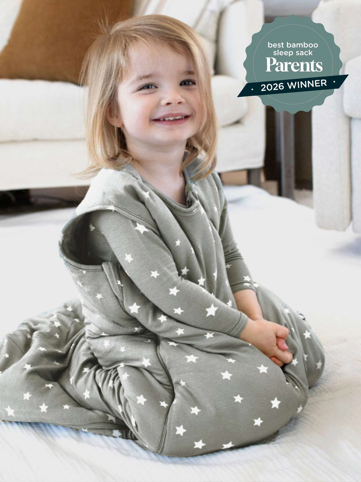 1.0 TOG sleep sack in sage gray with white stars, toddler wearing
