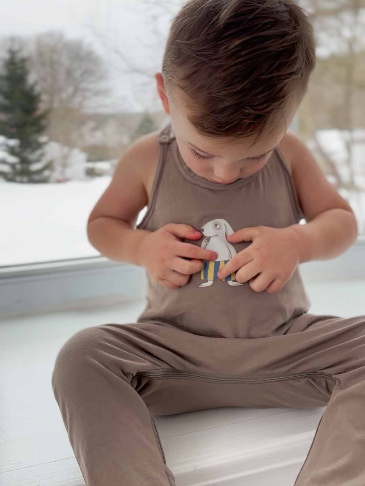 Kids' taupe tank romper with cute dog graphic on the front