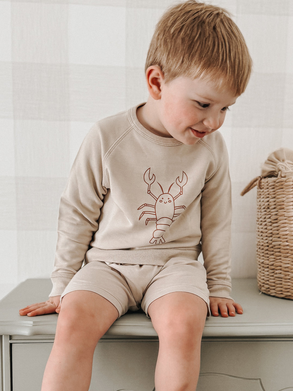 Tan crewneck sweatshirt with lobster outline print, long sleeves