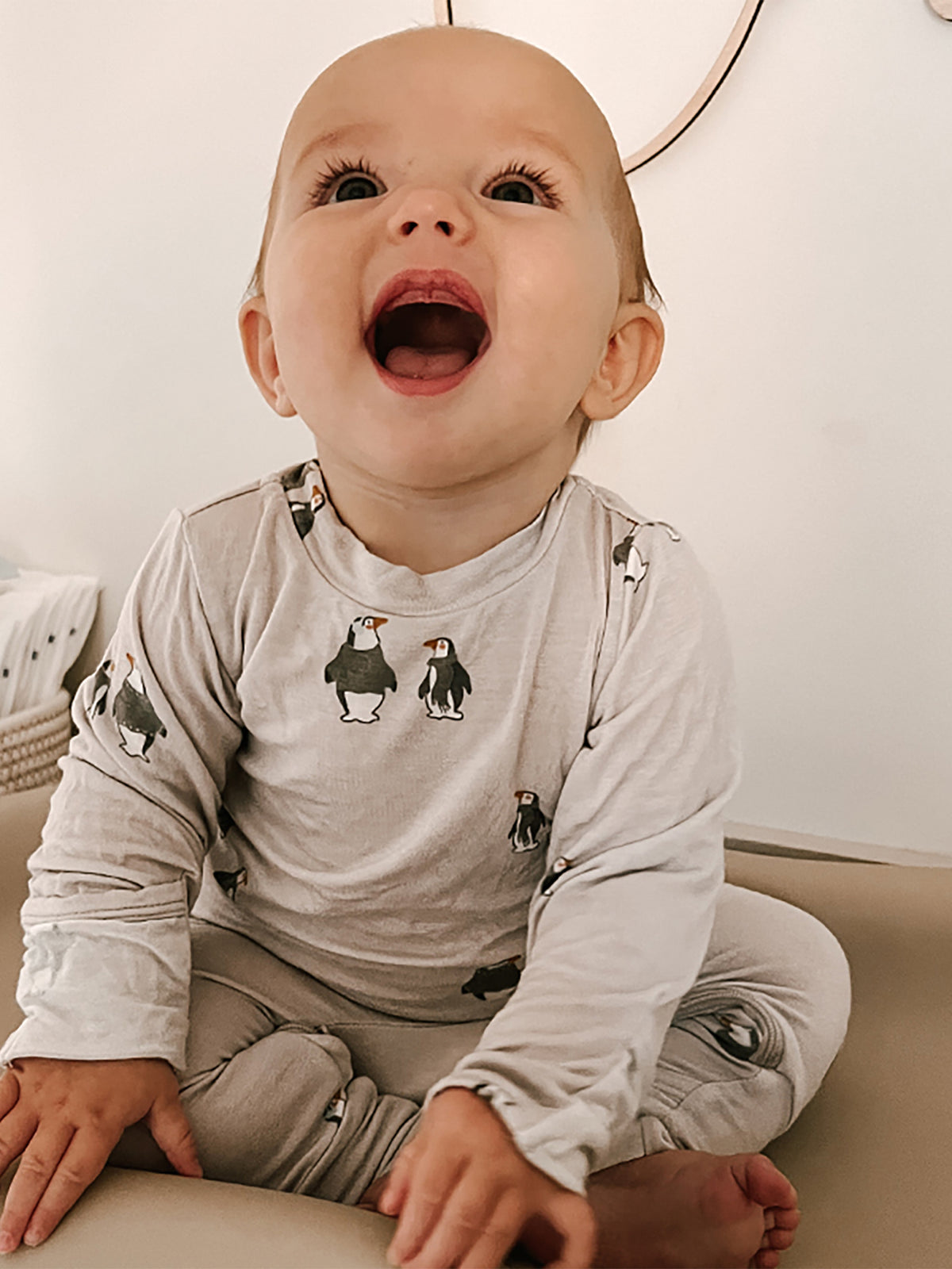 Baby gray penguin-print footie set with long sleeves and comfy footed pants