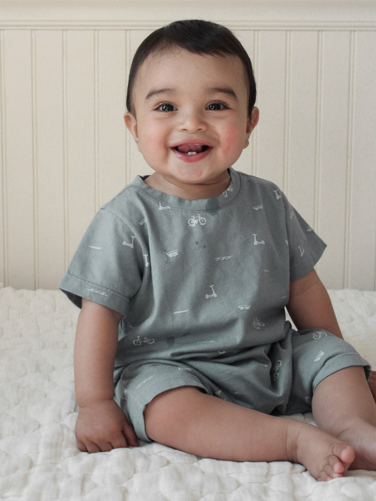 Gray-blue cotton shortie romper with dash pattern, short sleeves and open-leg shorts