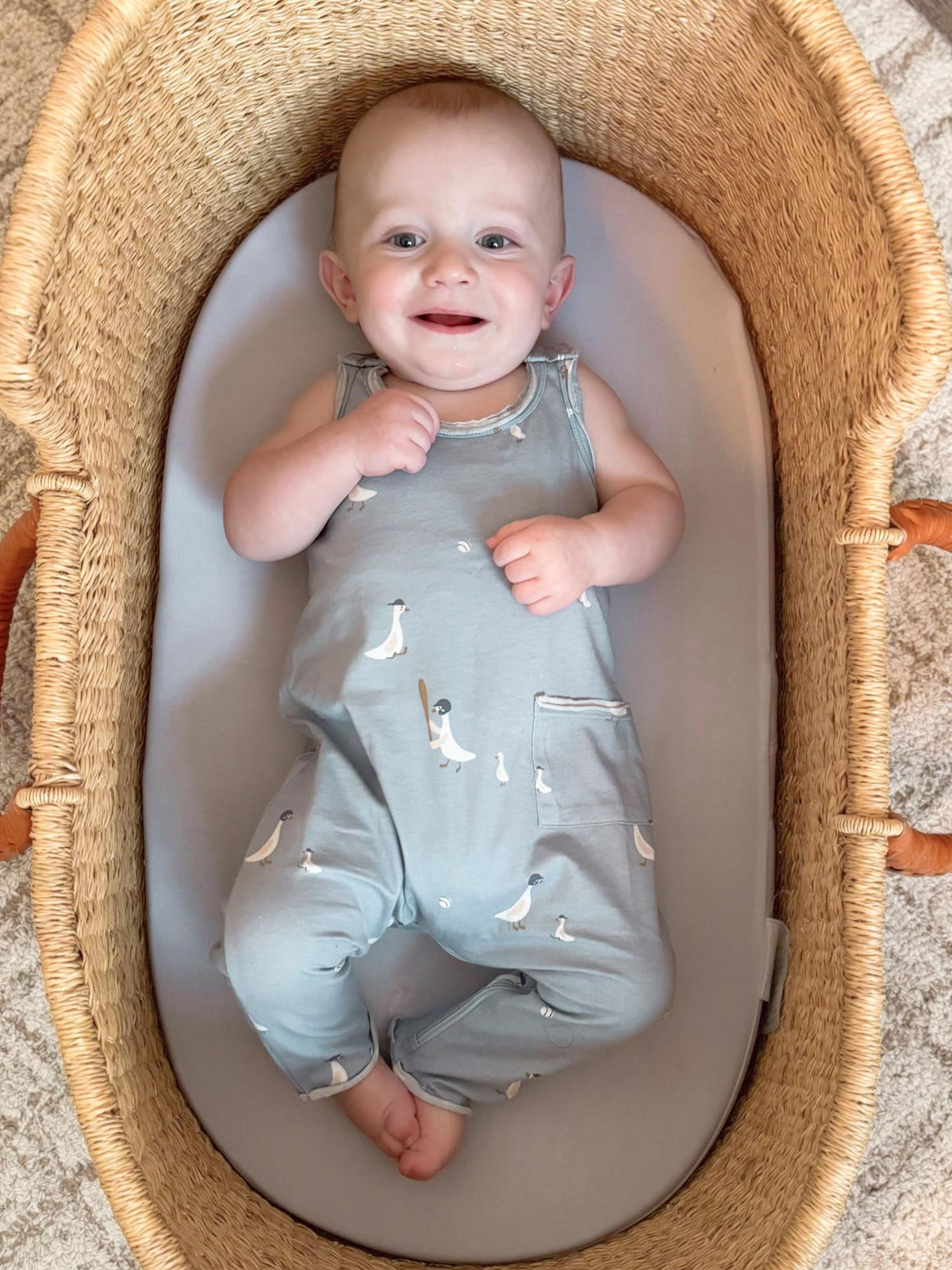 Light gray tank romper with goose prints and snap straps