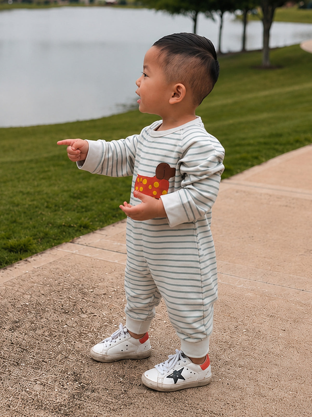 Gray-and-white striped fleece jumpsuit with dachshund graphic; full-length pant legs