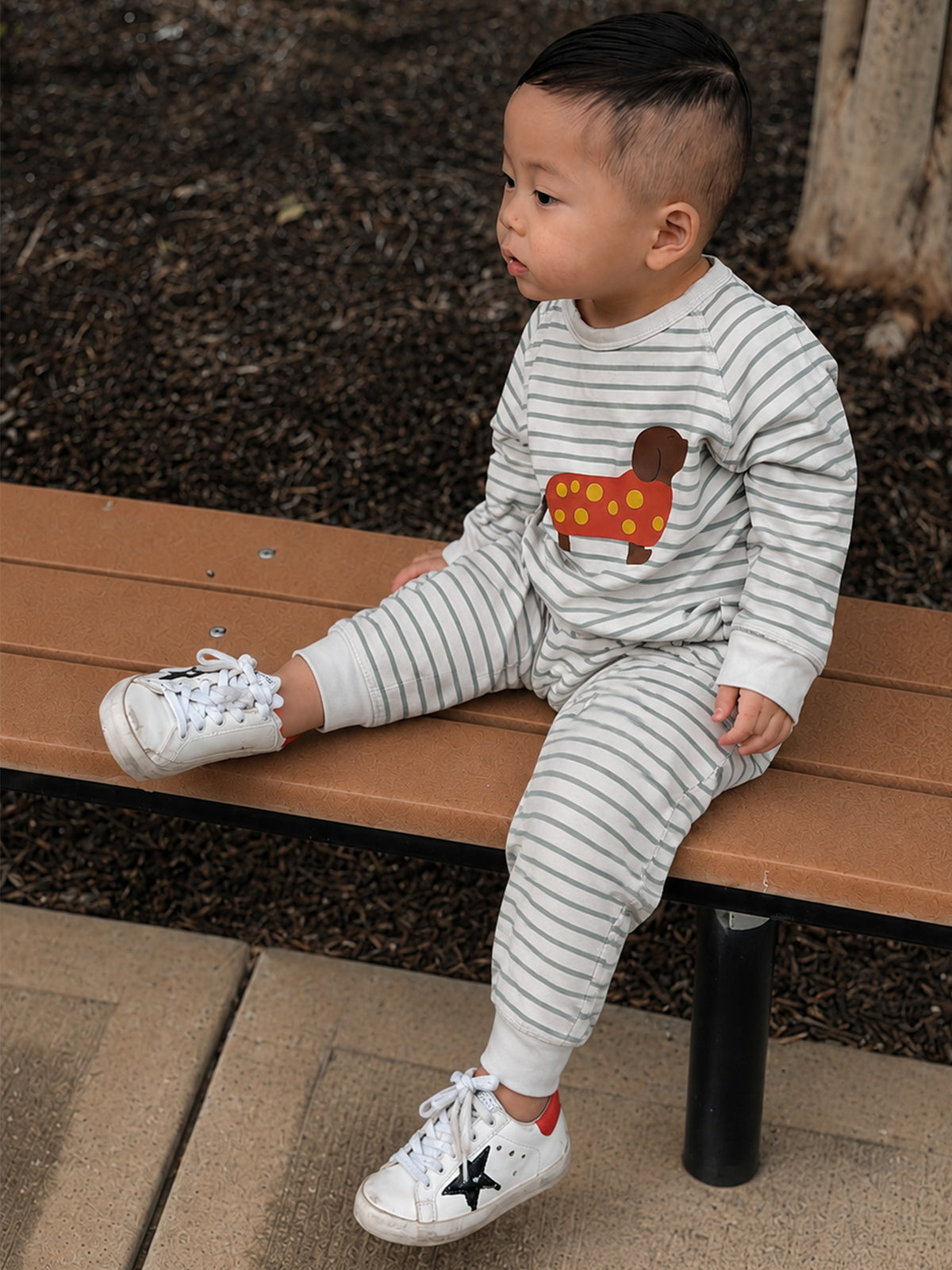 Gray-and-white striped fleece jumpsuit with dachshund graphic; cuffed pant legs