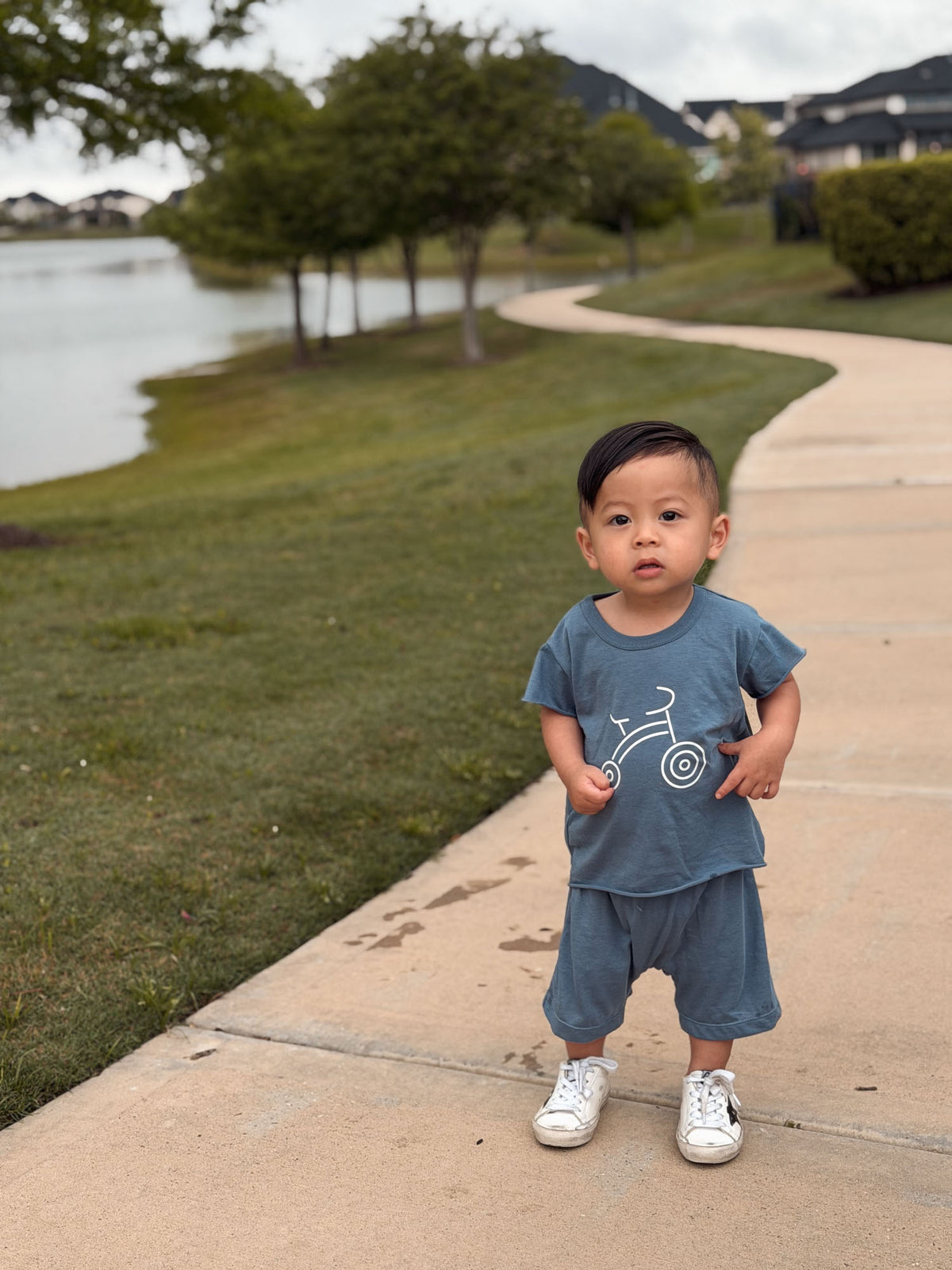 Boys' blue bike graphic T-shirt and matching shorts set, front view