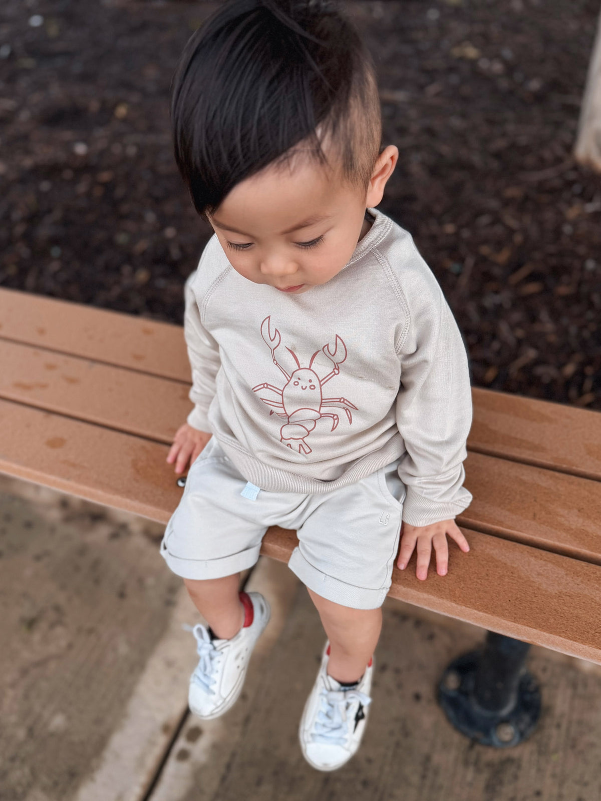 Light tan crewneck sweatshirt with rust lobster print and long sleeves