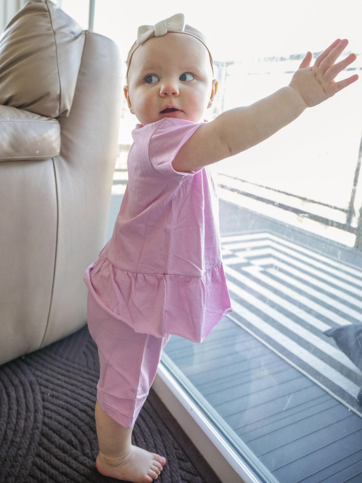 Lilac ruffled T-shirt and shorts set with lollipop graphic, short sleeves and ruffle bottom