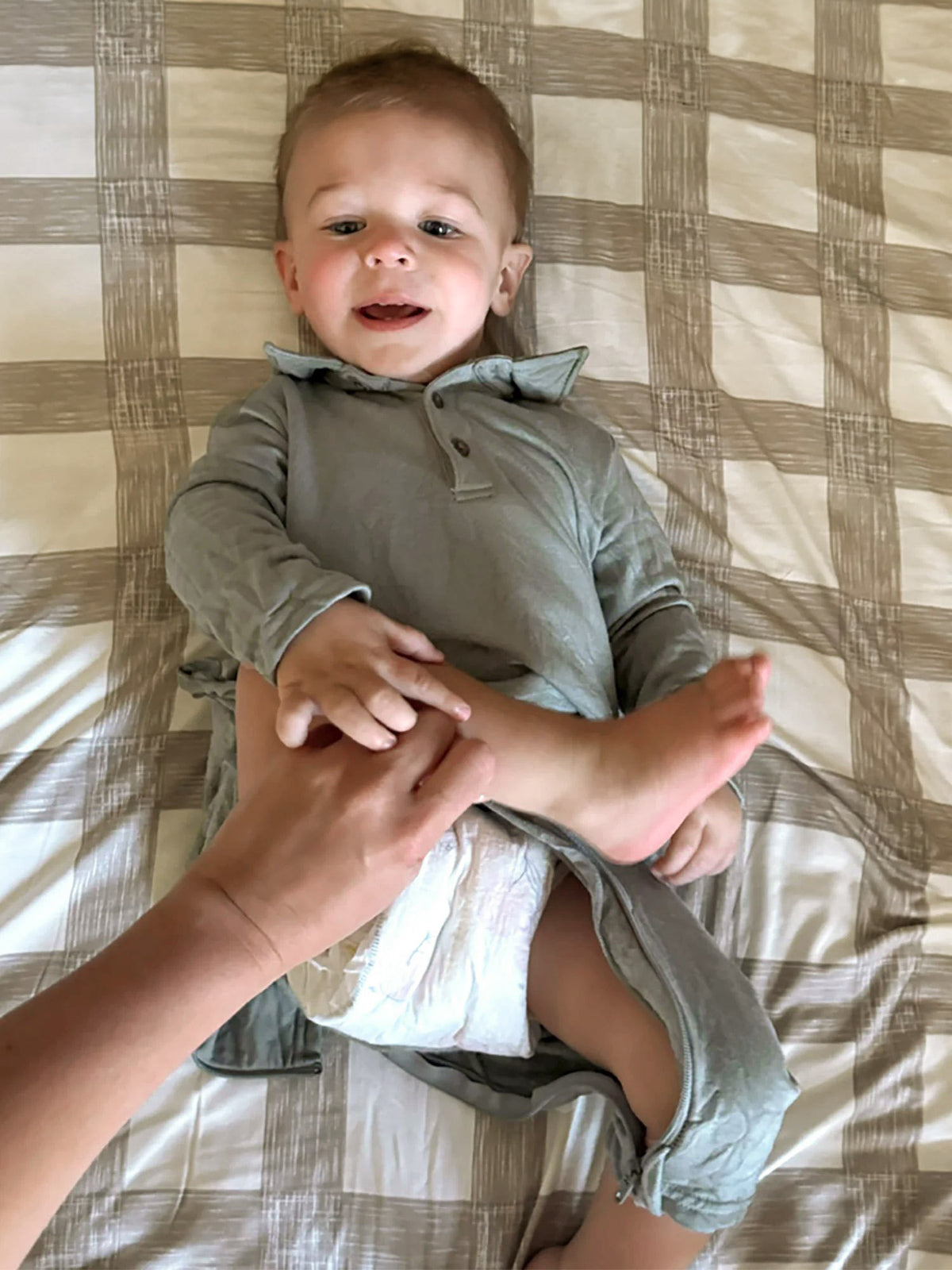 Sage green fleece collared jumpsuit with button-front and long sleeves, baby fit