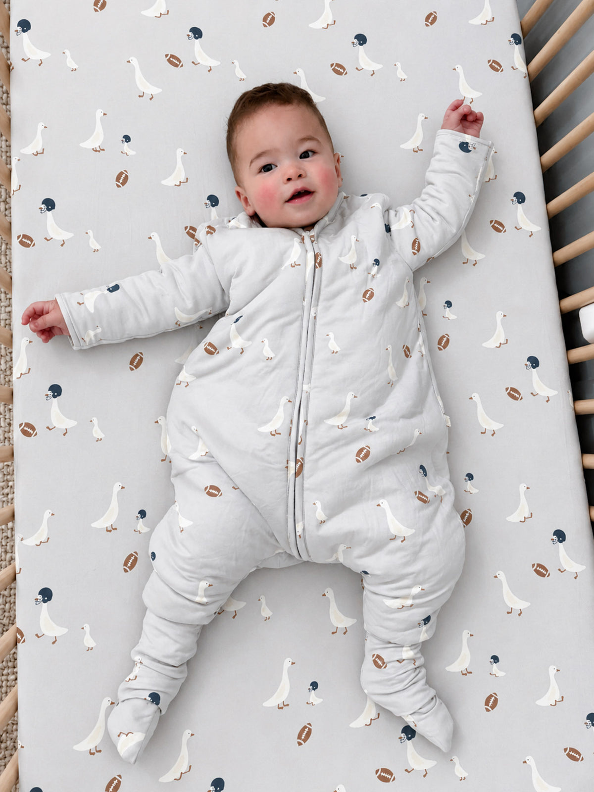 Baby long-sleeve footed sleep sack, goose and football pattern, front zip