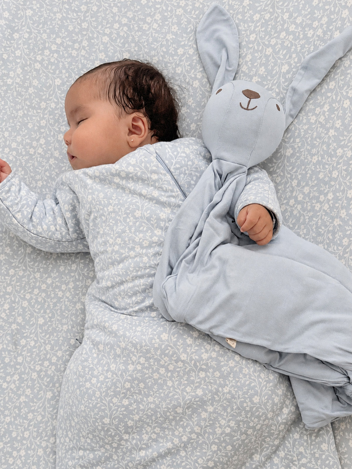 Light blue bunny-shaped lovey blanket with long ears and stitched face