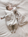 Light beige footie sleep sack with goose print, full-body zipper and built-in feet