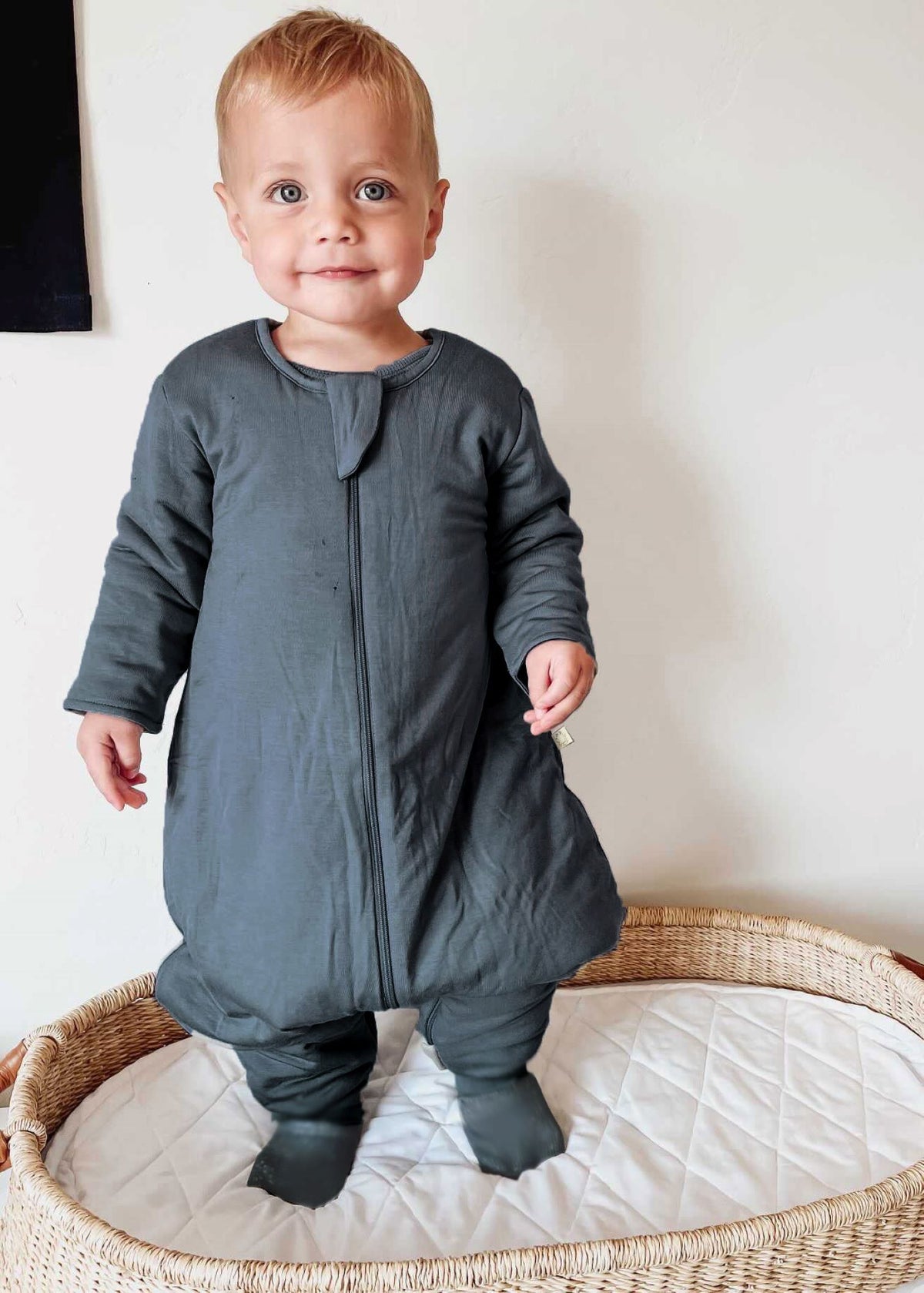 Gray long-sleeve footie sleep sack with zip-front, built-in feet.