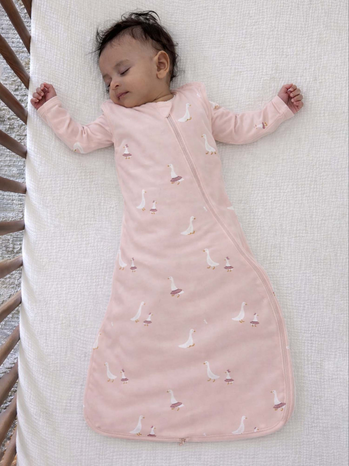 Light pink transitional swaddle sleep sack with bird print and zip front
