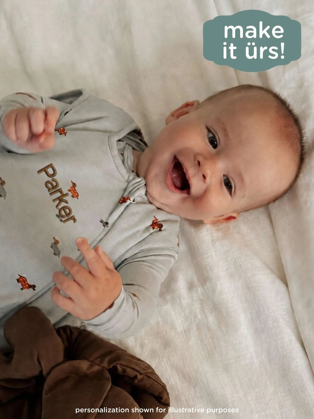 Light blue dachshund-print sleep sack with front zip and footed shape