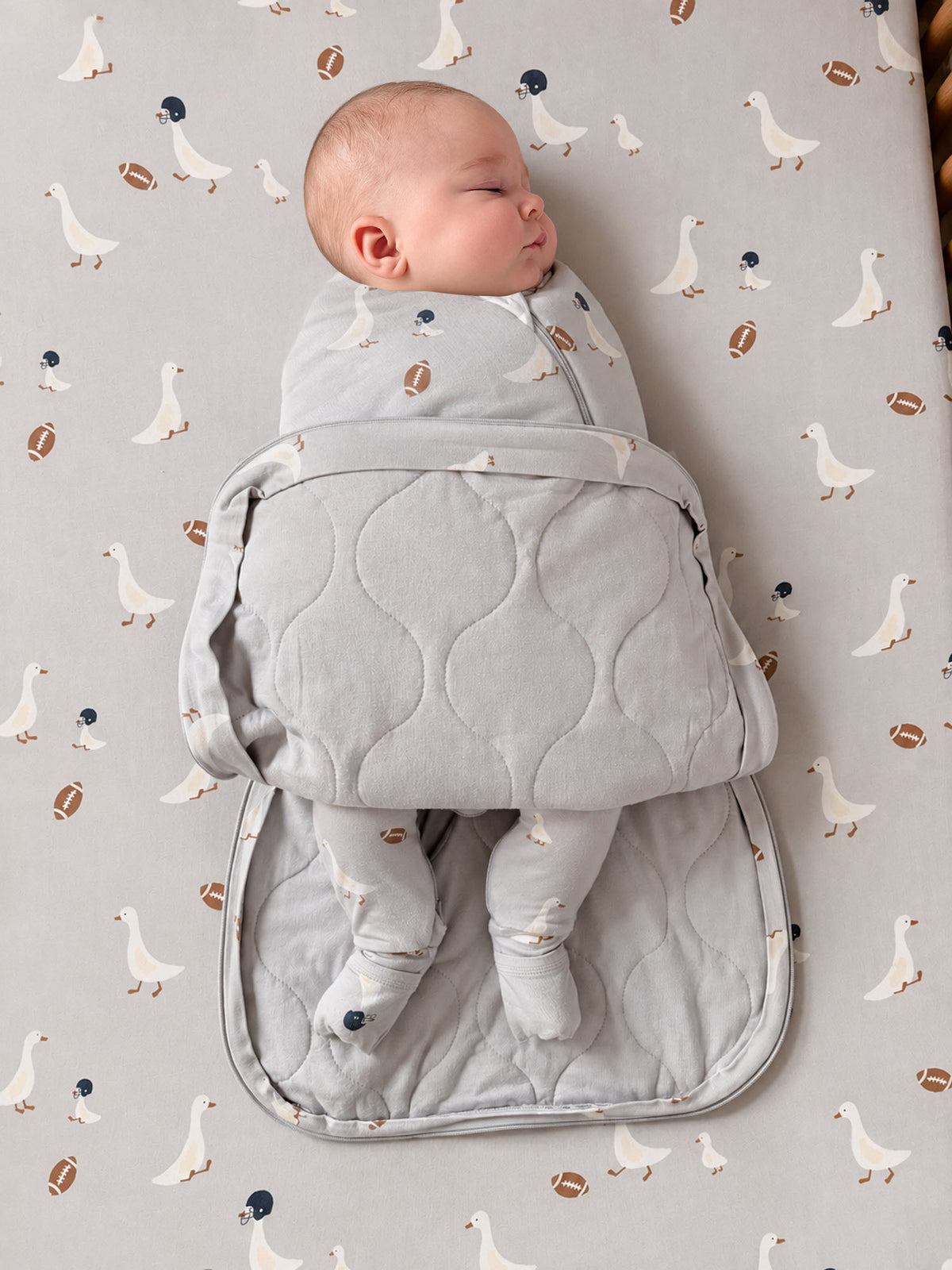 Swaddle sleep sack with football print and quilted front, 2.5 TOG, gray