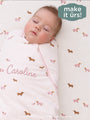 Dog-print swaddle sleep sack with pink front zipper and soft hooded wrap for baby