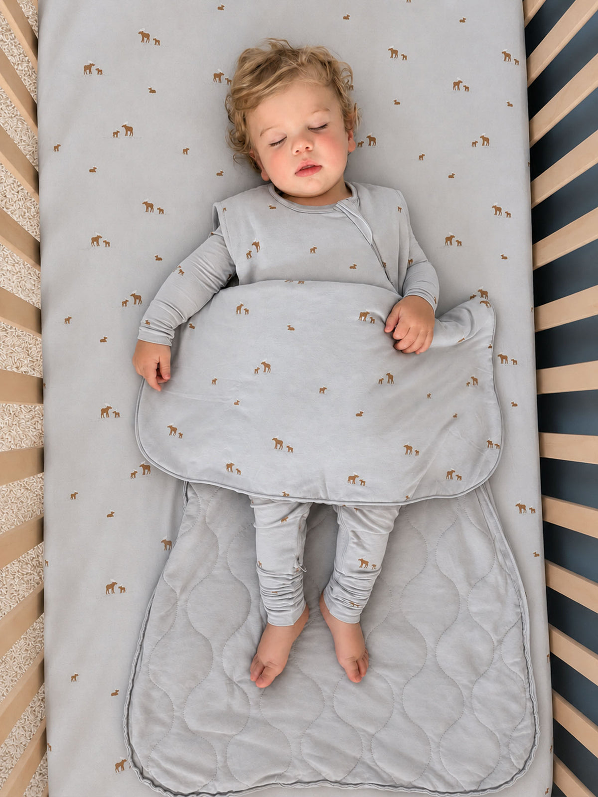 1.0 TOG sleep sack, light gray animal print, toddler in sack with padded bottom