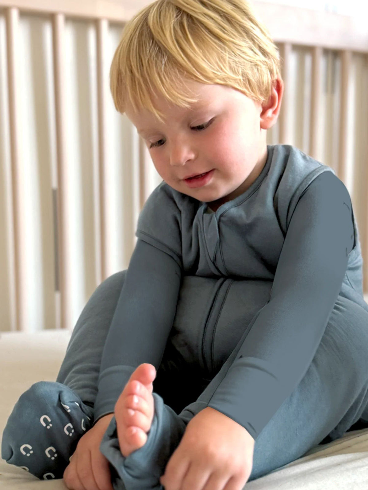 Hush 2.5 TOG footie sleep sack in blue-gray with long sleeves and zipper front