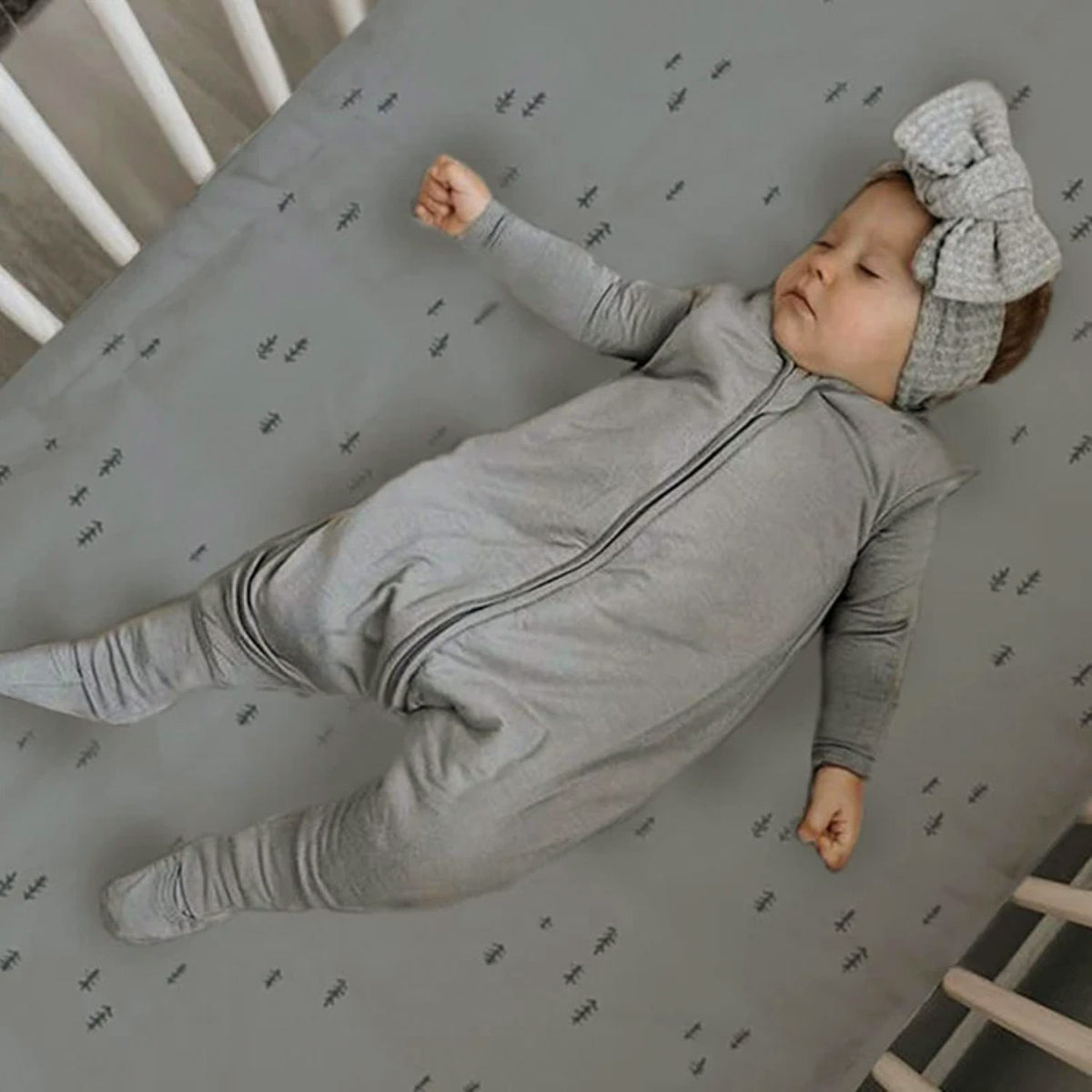 Sage green patterned footie sleep sack with zip front and long sleeves
