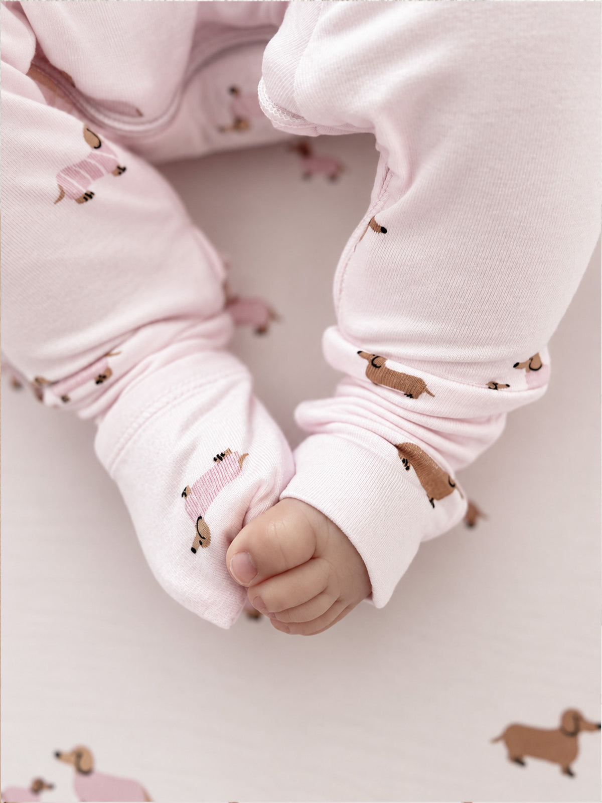 Dog-print footed pajama cuff and foot detail, light pink